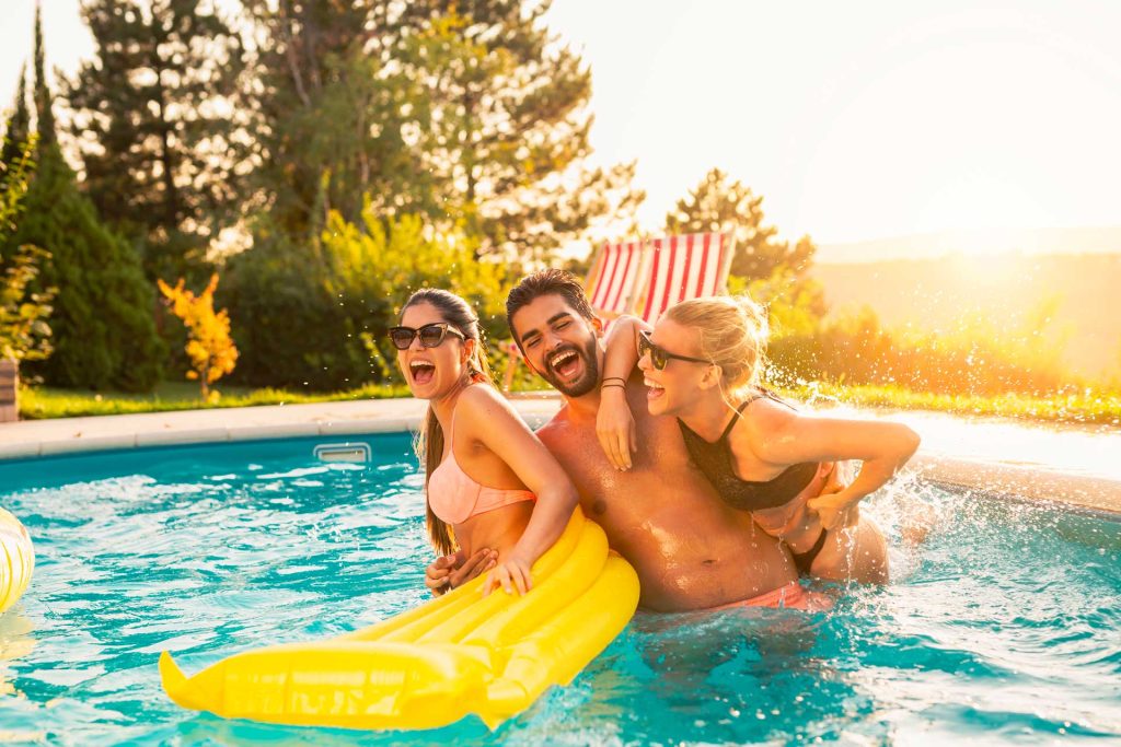 friends having fun at the swimming pool 2023 11 27 05 23 21 utc 1024x683 1